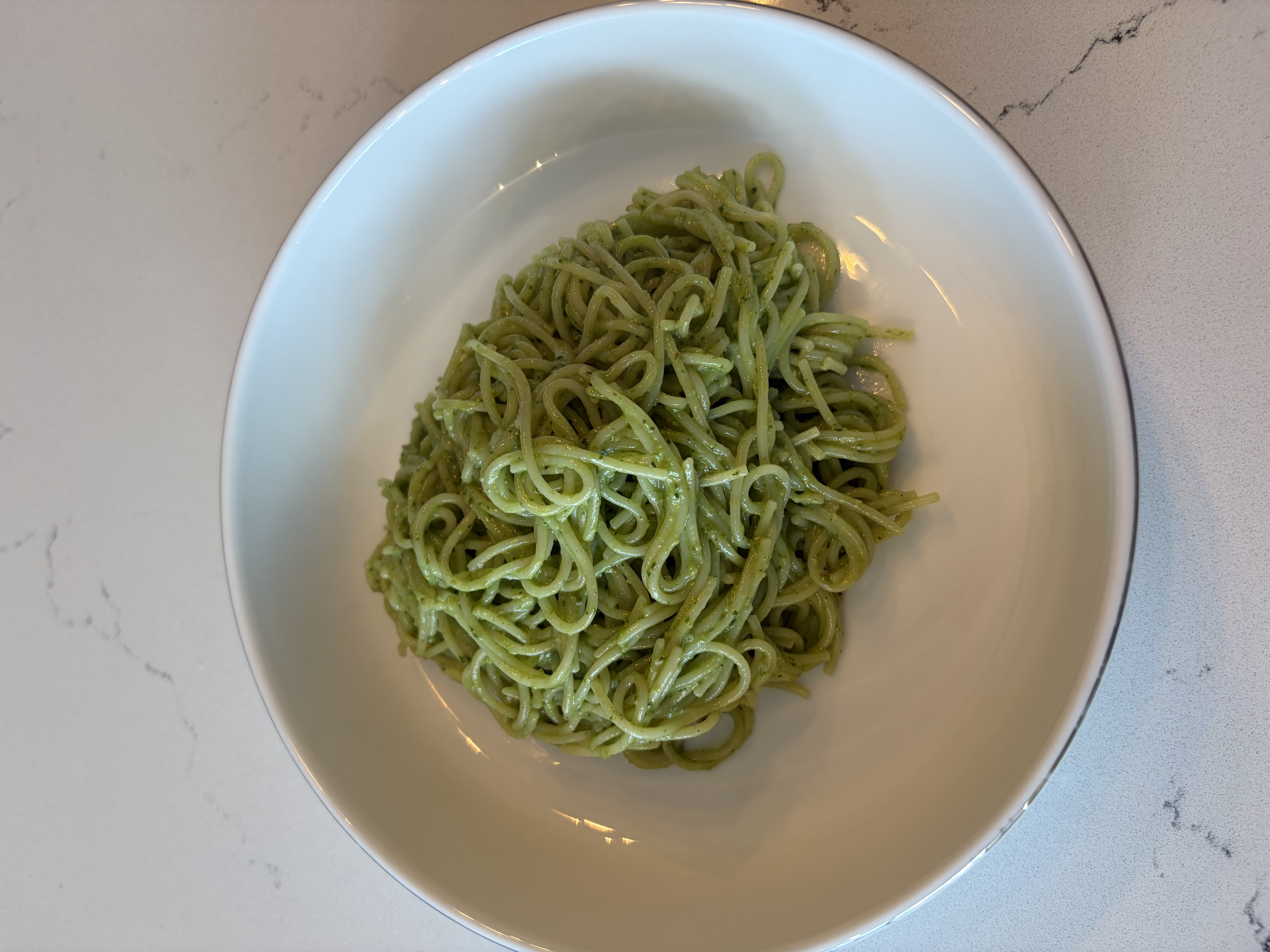 Creamy pesto pasta in a bowl